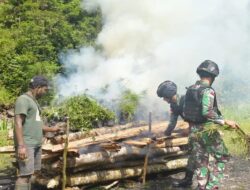 Satgas Yonif 116/Garda Samudra Bersama Warga Papua Menngadakan Acara Bakar Batu Dalam Rangka Panen Hasil Kebun